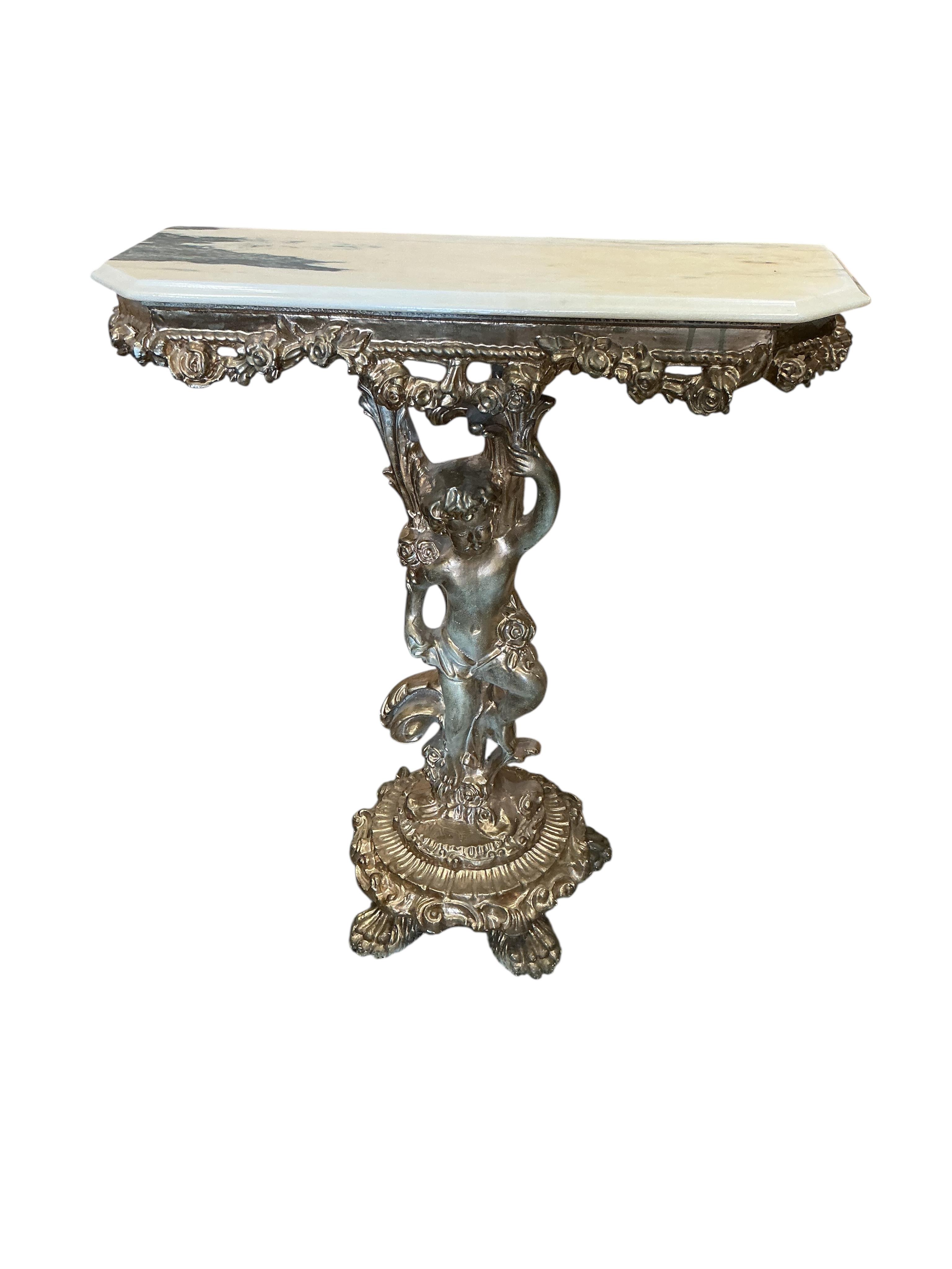 A gilt composition cherub column console table with faux marble top and a similar wall mirror, table width 73cm, depth 26cm, height 83cm.